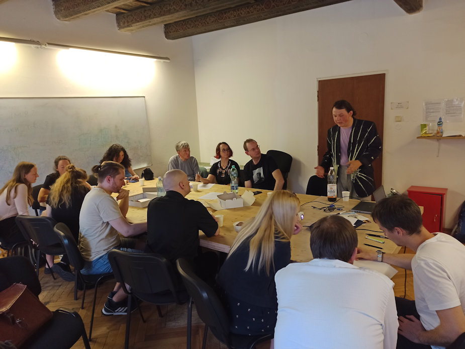 Workshop with groups of people sitting at the table